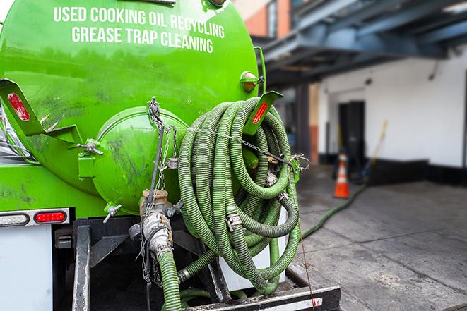 a professional service truck pumping a grease trap in Alameda, CA